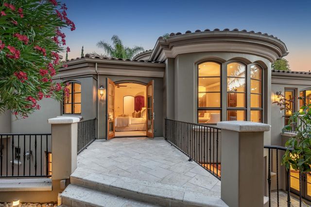 a view of a chairs and table in the patio