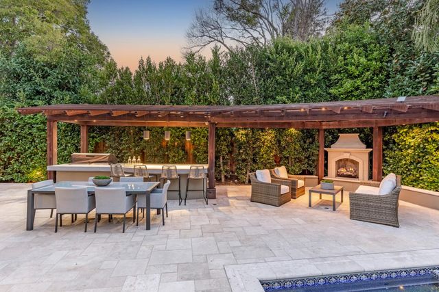 a view of a chairs and table in a patio