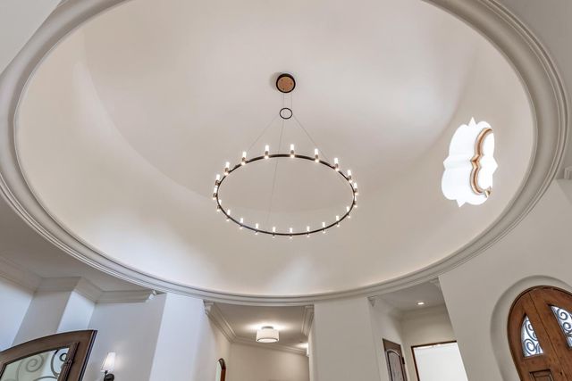 a view of a livingroom with wooden floor and a large window