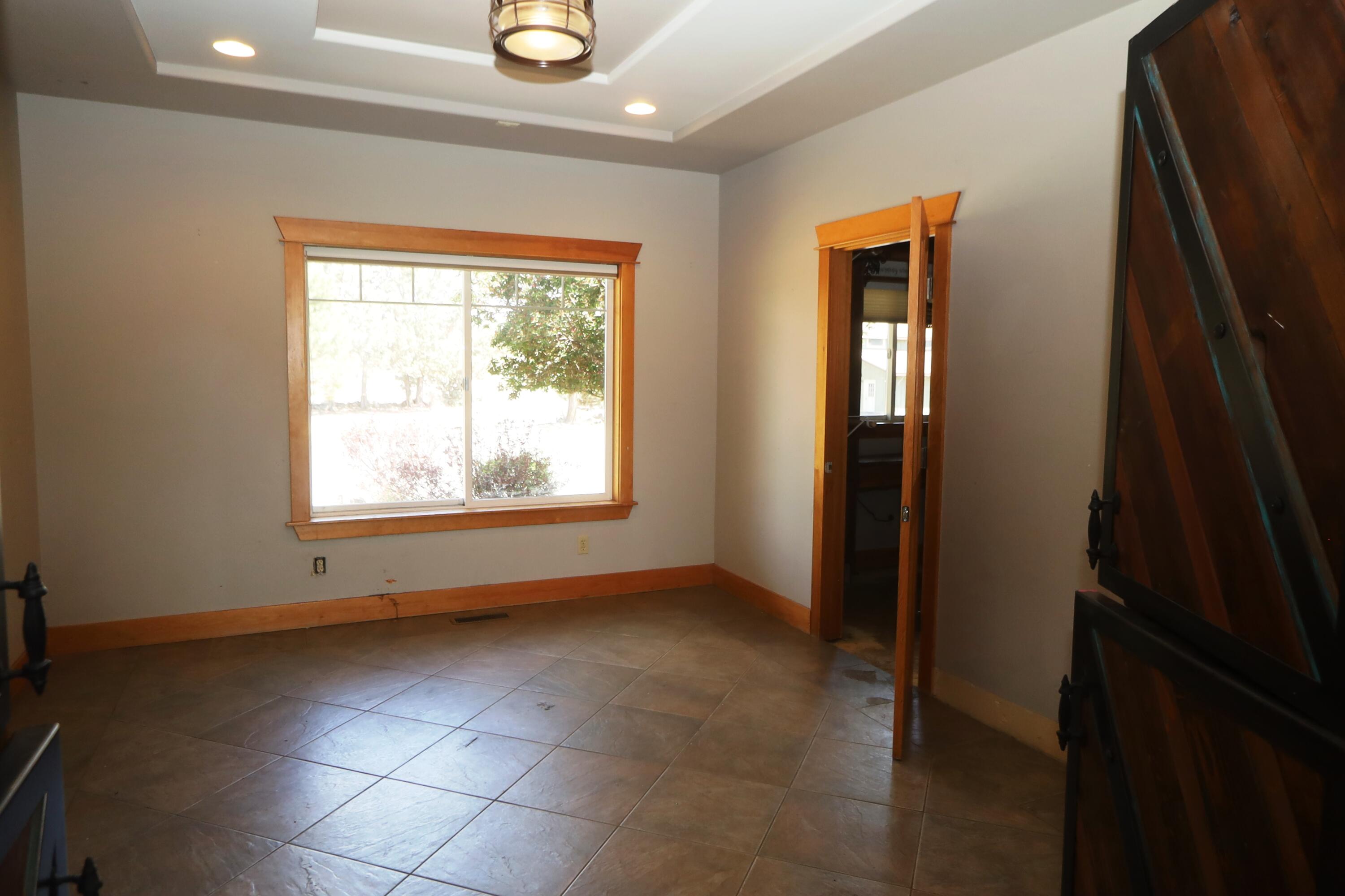 21491 Bear Creek Road Bend, OR 97701 - Photo 15 of 45 a view of an empty room with a window
