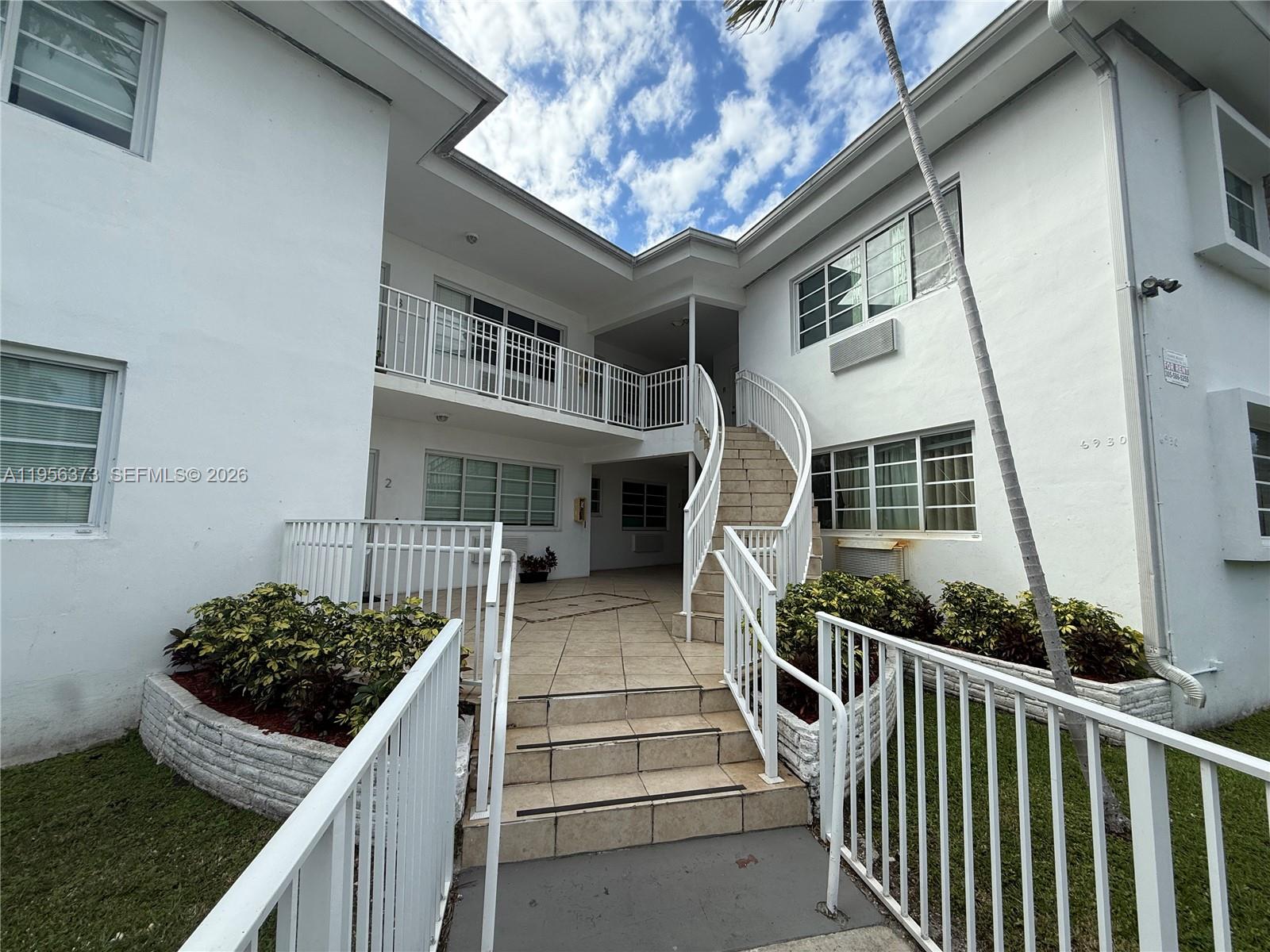 6930 Rue Vendome, Unit 3 Miami Beach, FL 33141 - Photo 2 of 14 a house view with a garden