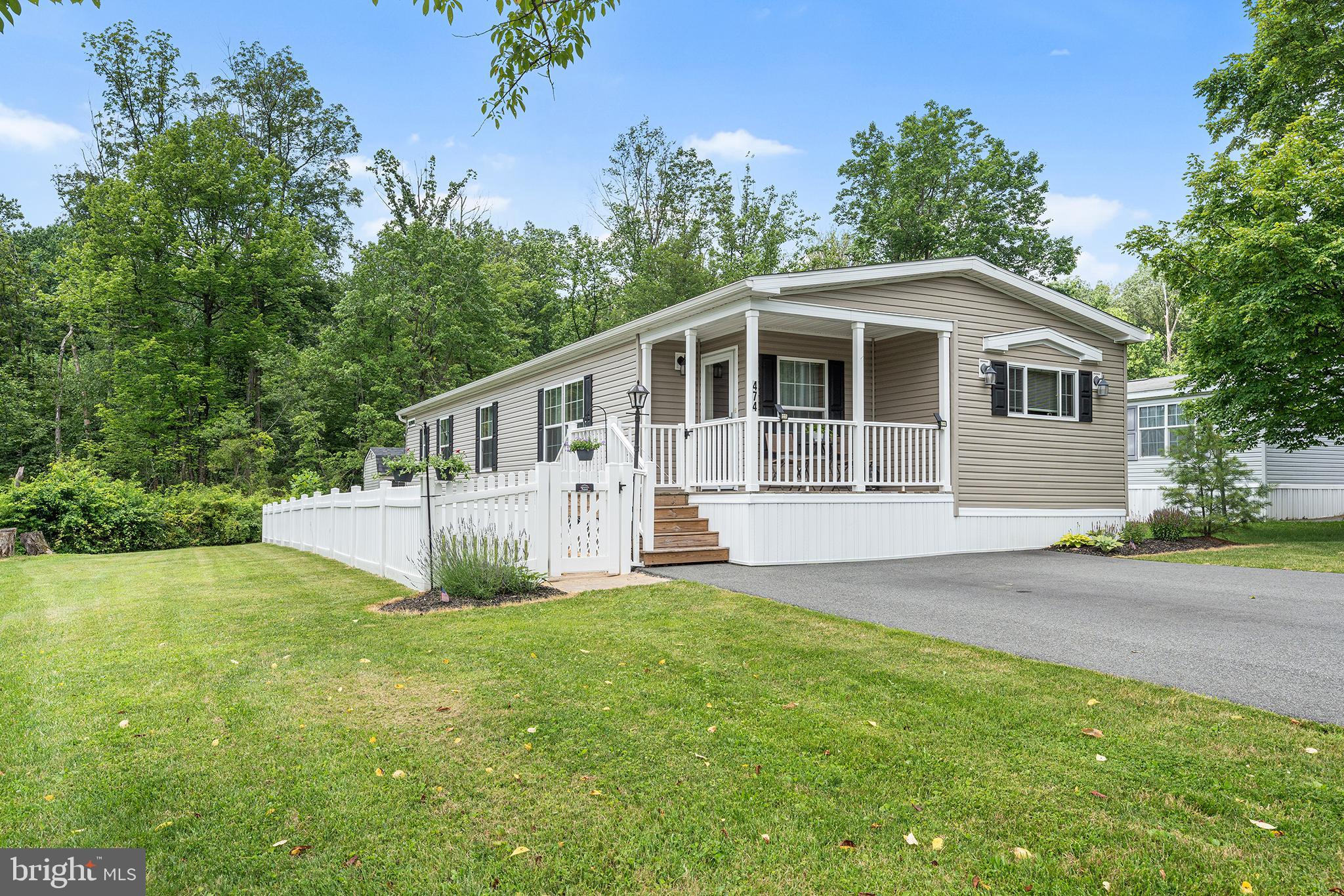 474 Barrington Road Macungie, PA 18062 - Photo 1 of 28 a front view of a house with a garden and yard
