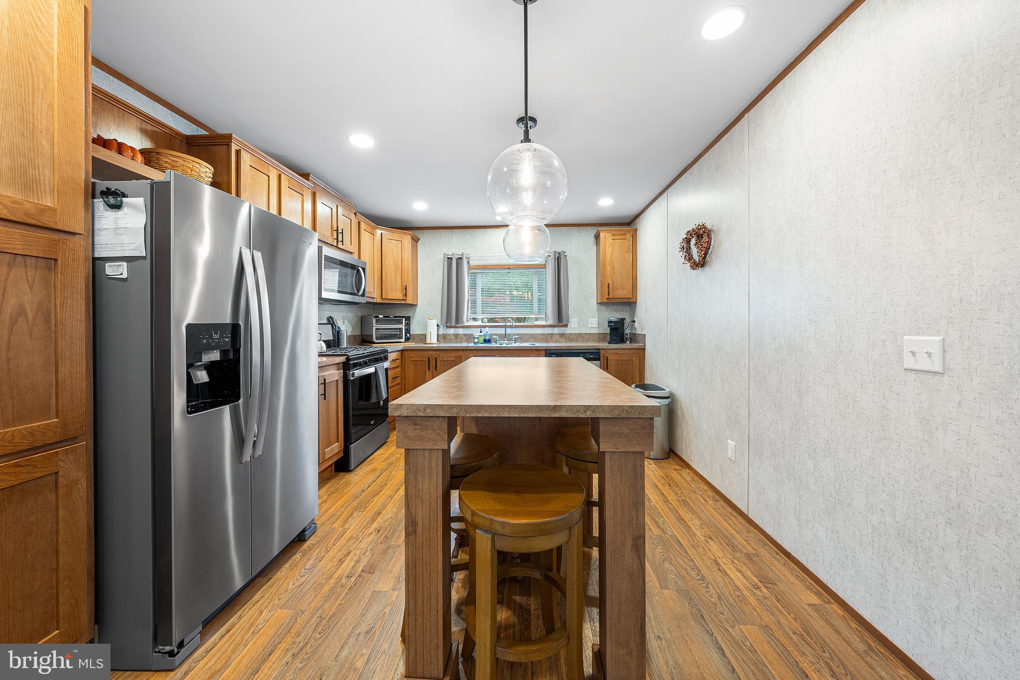 474 Barrington Road Macungie, PA 18062 - Photo 11 of 28 a kitchen with a refrigerator a sink and wooden floor