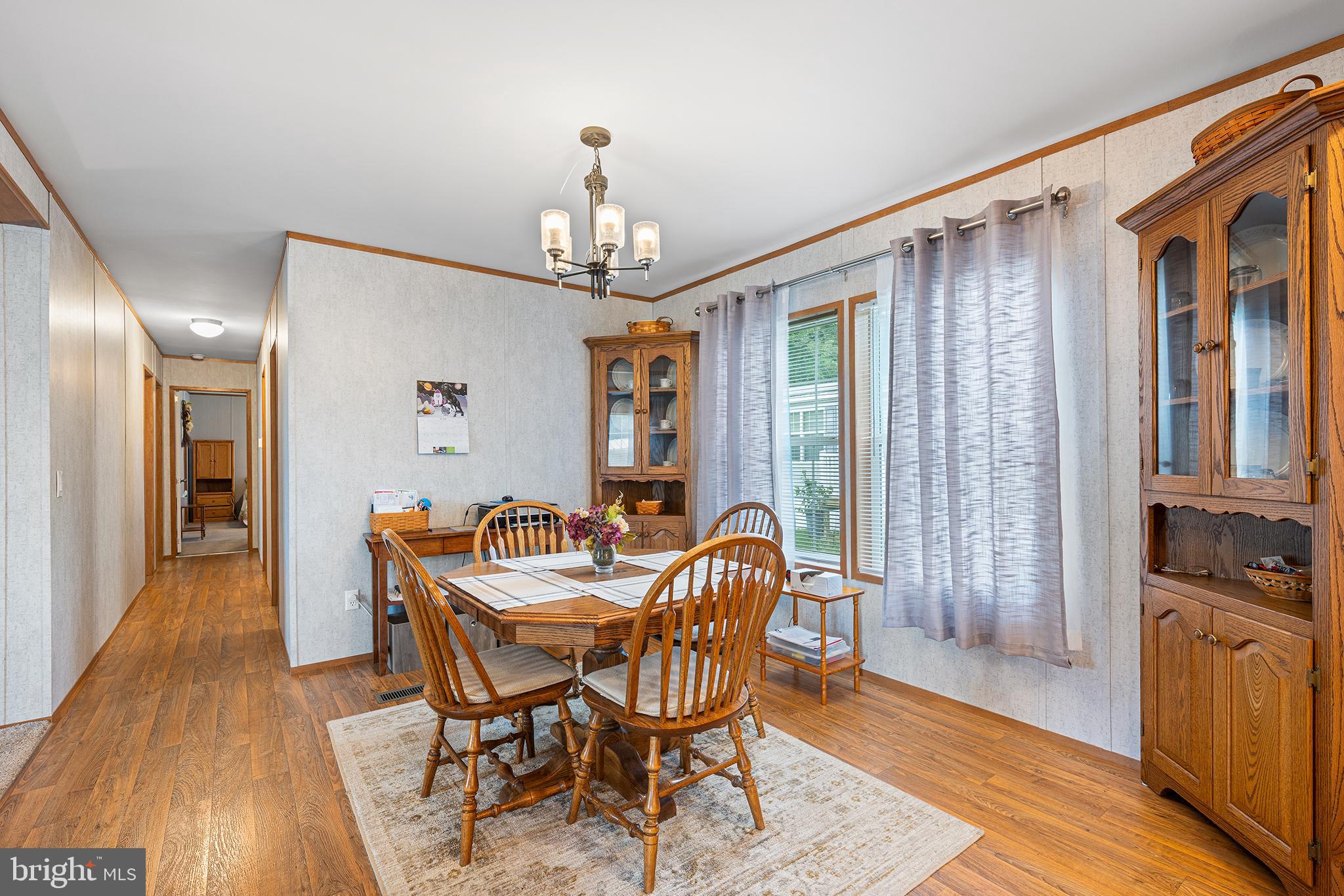 474 Barrington Road Macungie, PA 18062 - Photo 13 of 28 a dining room with furniture a chandelier and wooden floor
