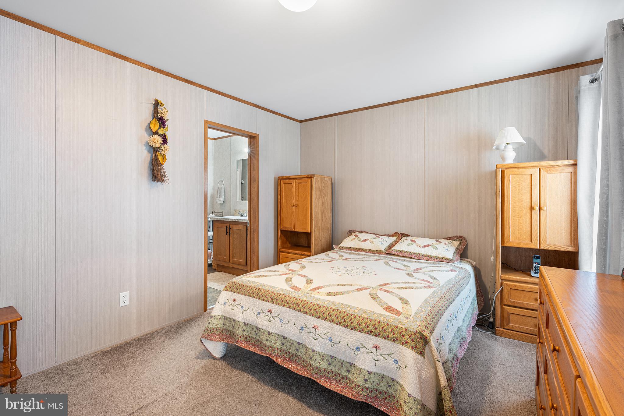 474 Barrington Road Macungie, PA 18062 - Photo 19 of 28 a bedroom with a bed and a table
