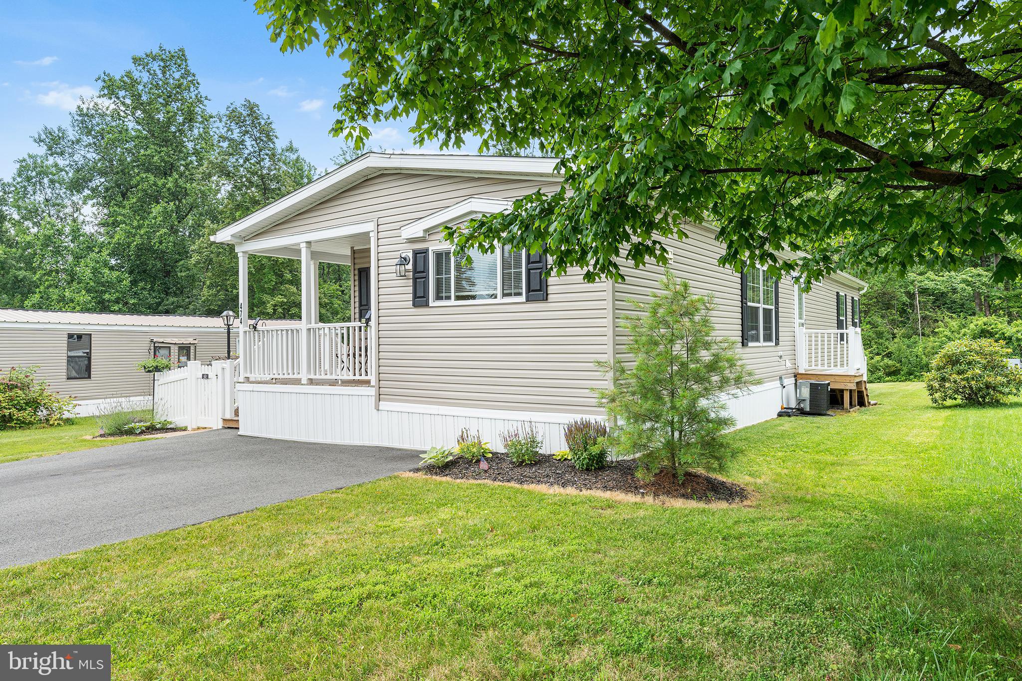 474 Barrington Road Macungie, PA 18062 - Photo 2 of 28 a front view of a house with a yard and garage