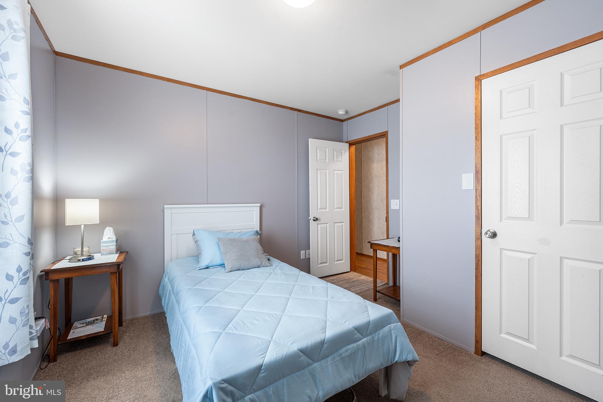 474 Barrington Road Macungie, PA 18062 - Photo 24 of 28 a bedroom with a bed and a refrigerator