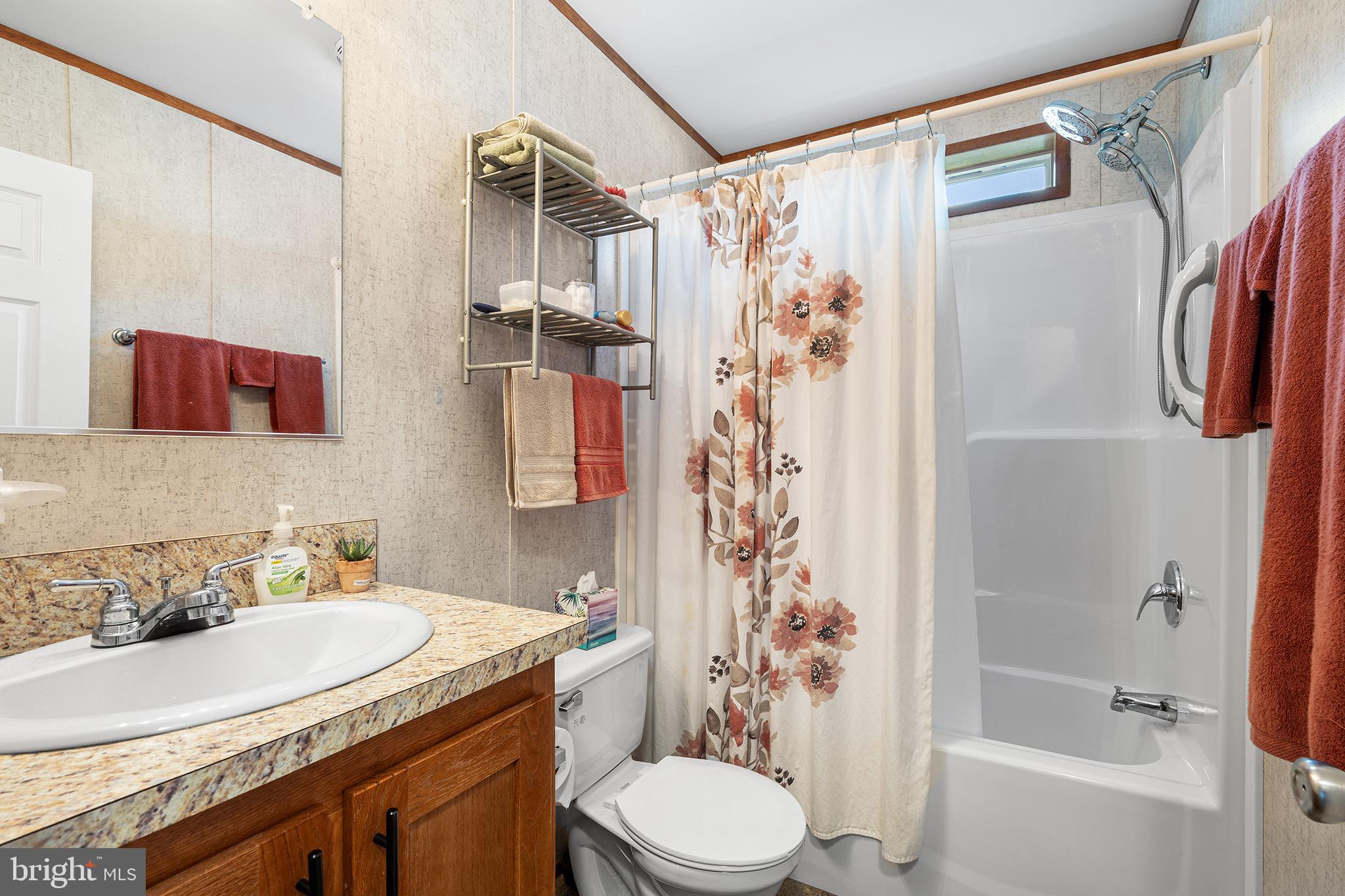 474 Barrington Road Macungie, PA 18062 - Photo 27 of 28 a bathroom with a granite countertop sink toilet and shower