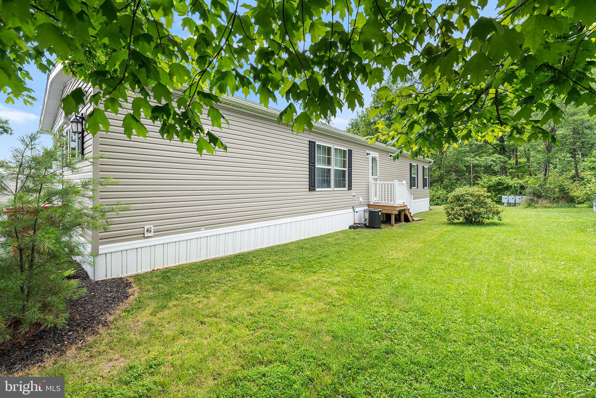 474 Barrington Road Macungie, PA 18062 - Photo 7 of 28 a white house that has a tree in front of it