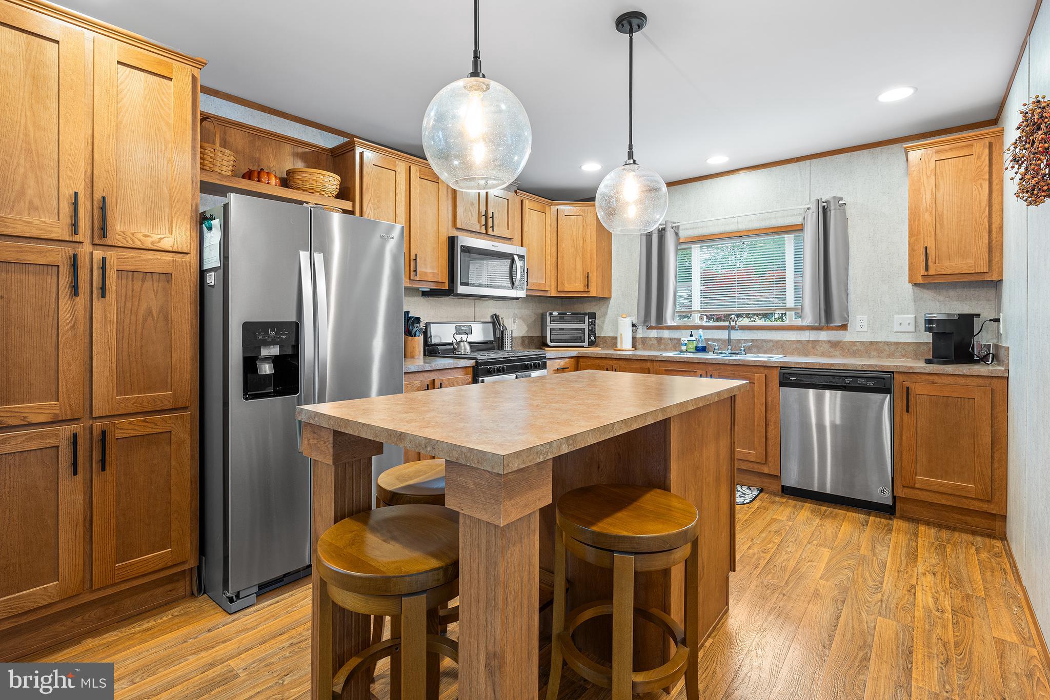 474 Barrington Road Macungie, PA 18062 - Photo 9 of 28 a kitchen with stainless steel appliances granite countertop a sink a stove and refrigerator
