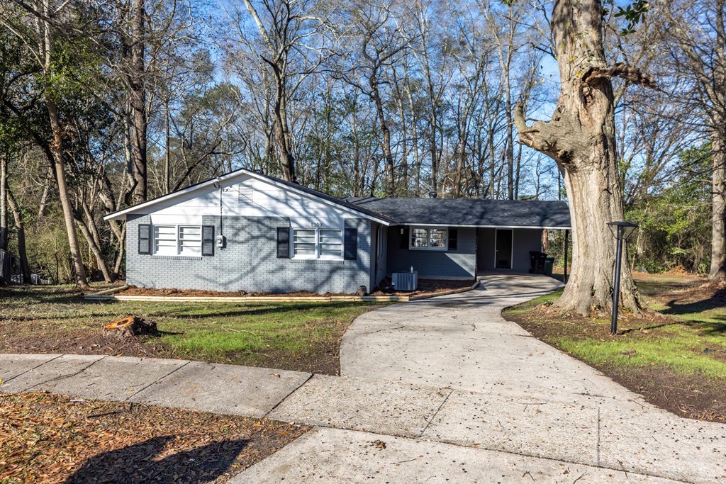 5100 Buckingham Court Columbus, GA 31907 - Photo 2 of 24 a front view of a house with a yard