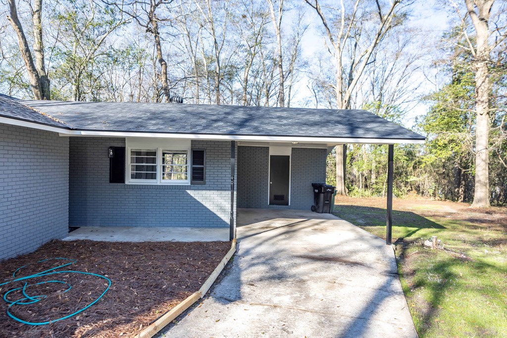 5100 Buckingham Court Columbus, GA 31907 - Photo 5 of 24 a house view with a sitting space and large trees