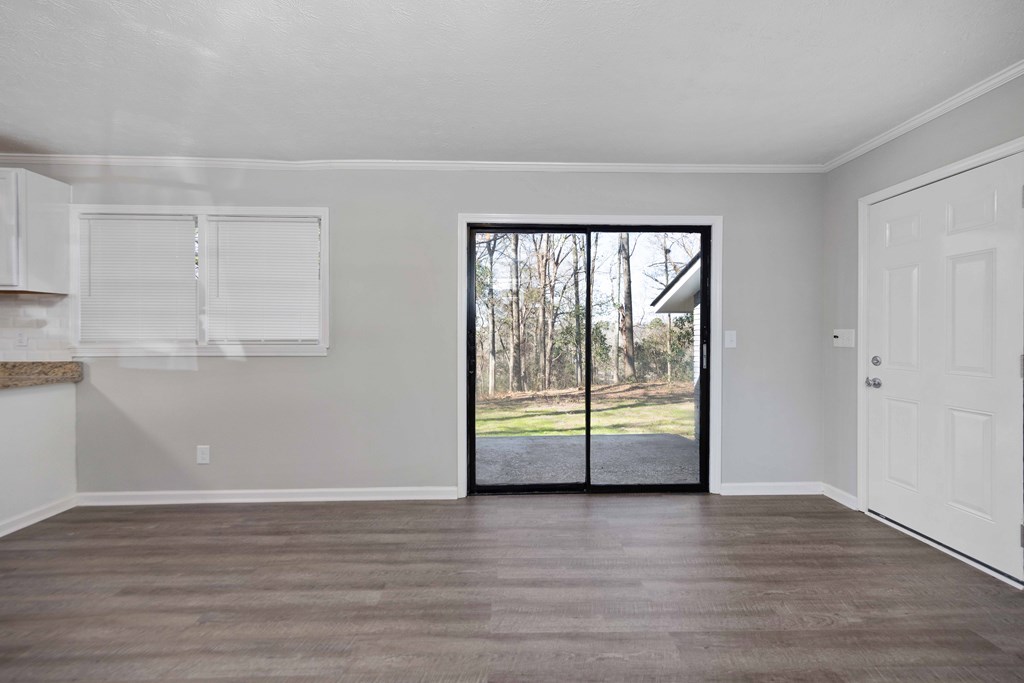 5100 Buckingham Court Columbus, GA 31907 - Photo 10 of 24 an empty room with wooden floor and windows