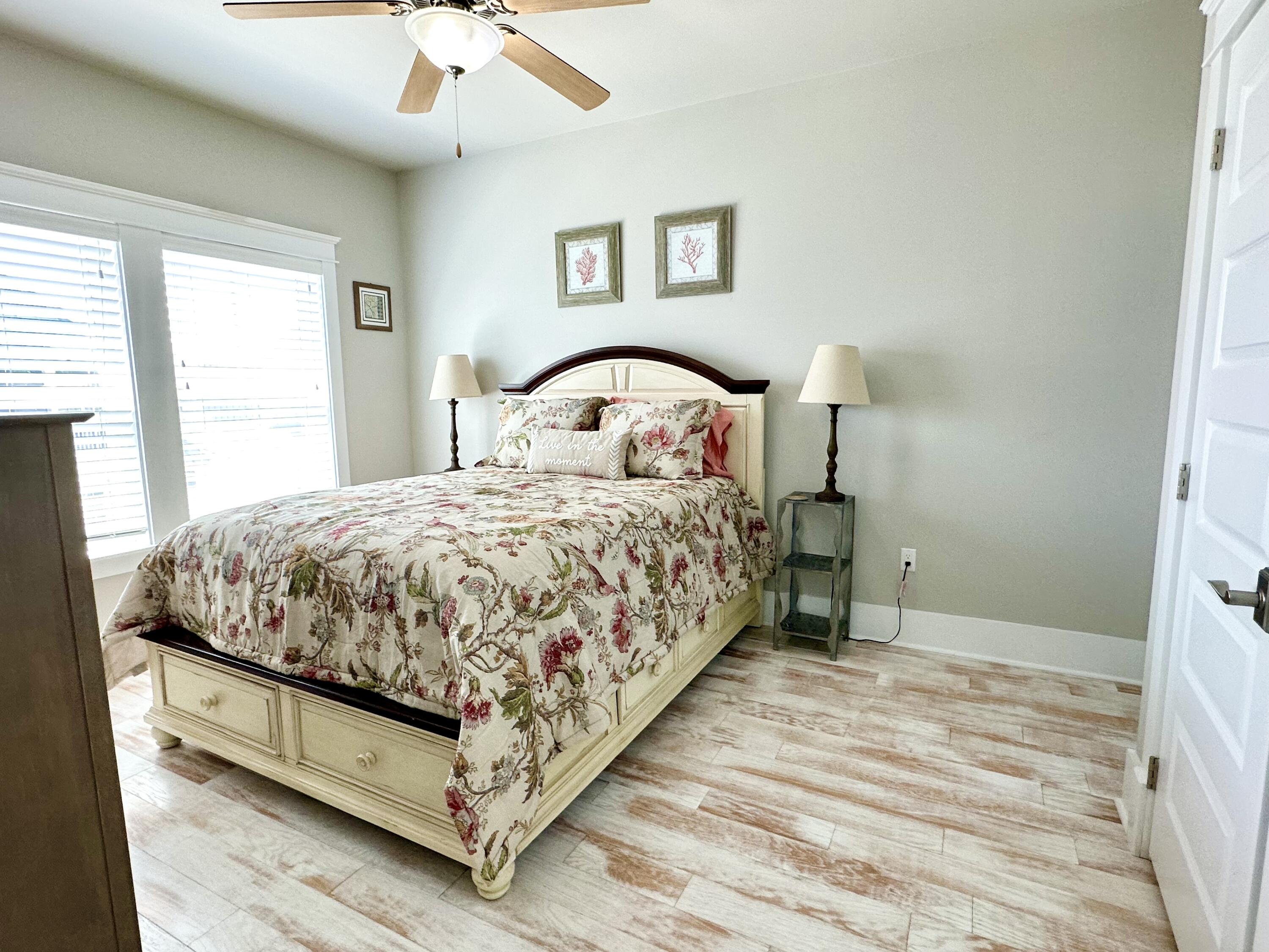 1422 Seaside Circle Navarre, FL 32566 - Photo 14 of 42 a bedroom with a bed and window