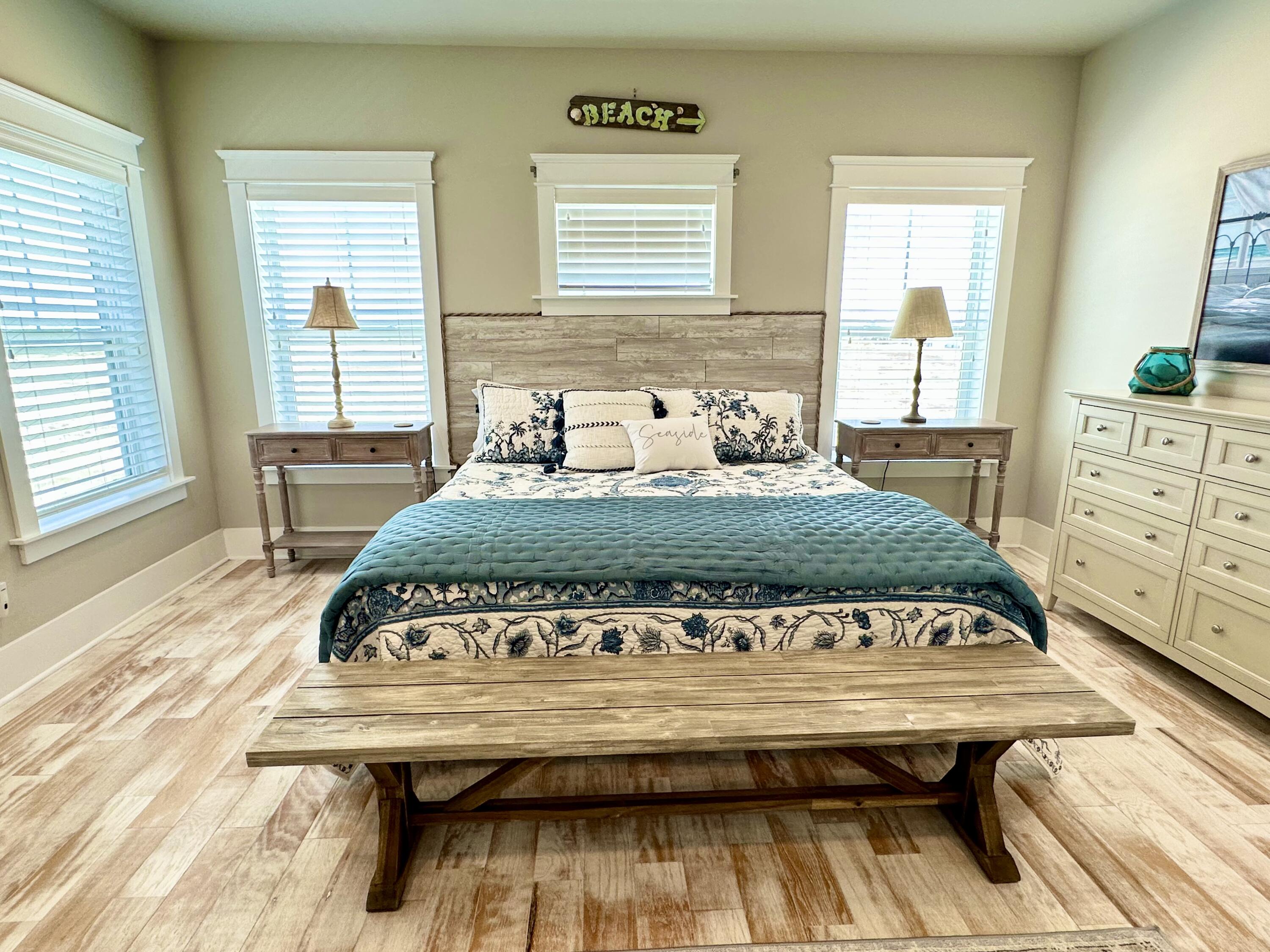 1422 Seaside Circle Navarre, FL 32566 - Photo 20 of 42 a bedroom with a bed and windows