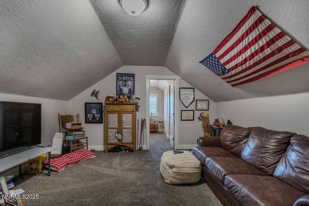 314 Bens Way Fernley, NV 89408 - Photo 28 of 43 a living room with furniture and a flat screen tv