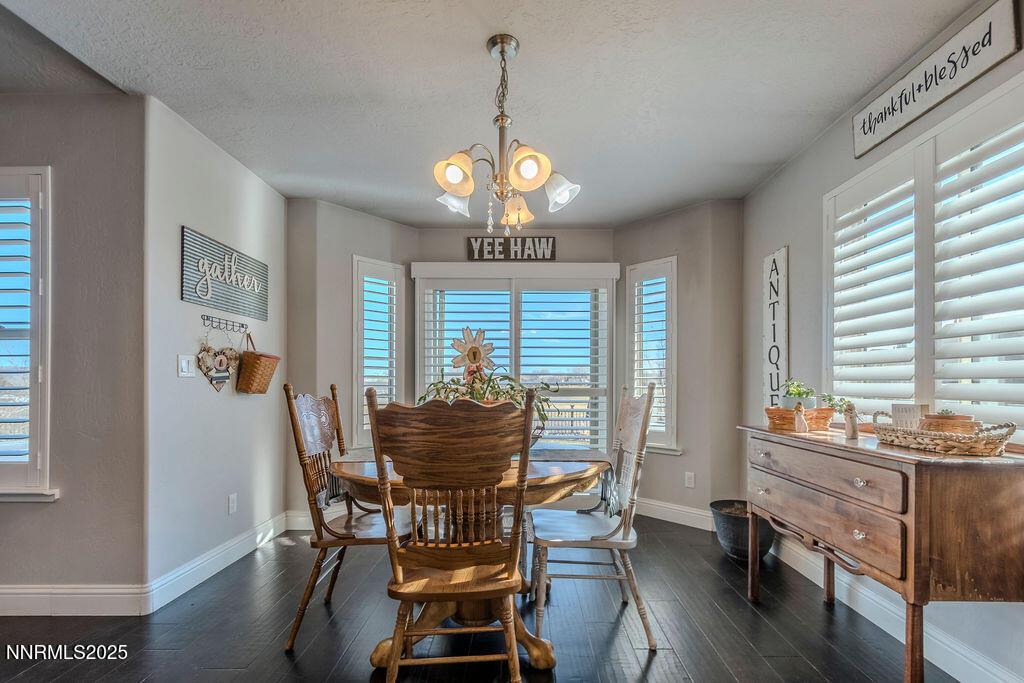 314 Bens Way Fernley, NV 89408 - Photo 8 of 43 a dining room with furniture window and wooden floor
