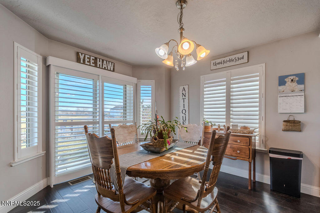 314 Bens Way Fernley, NV 89408 - Photo 9 of 43 a view of a dining room with furniture window and wooden floor