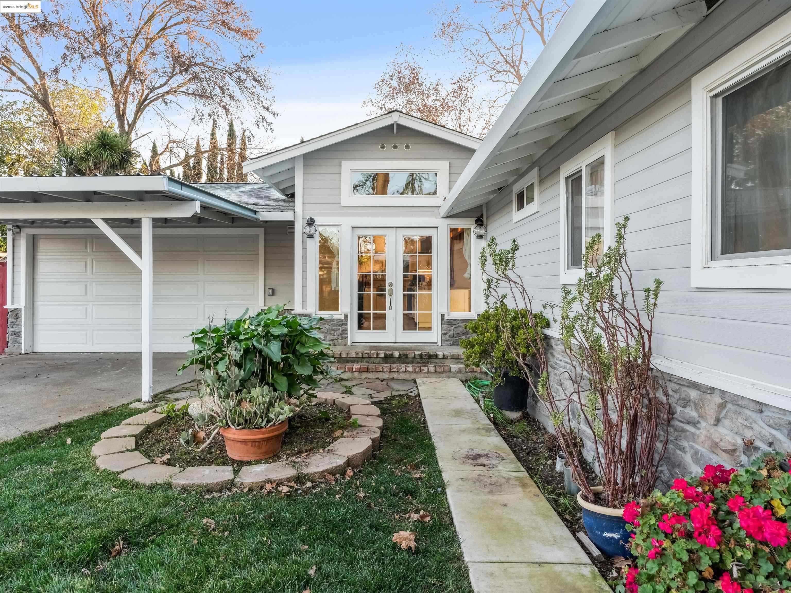 1650 Dorchester Place Concord, CA 94519 - Photo 1 of 1 a front view of a house with a yard and potted plants