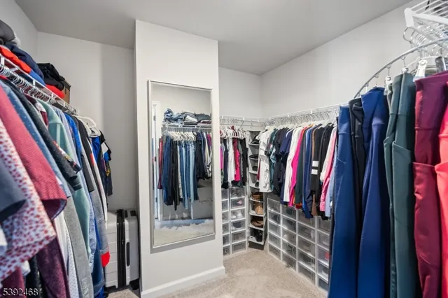 a bathroom with a granite countertop sink a mirror and a vanity