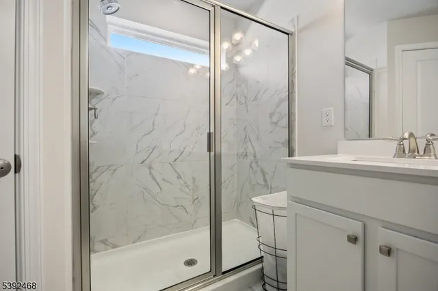 a bedroom with furniture and a large window