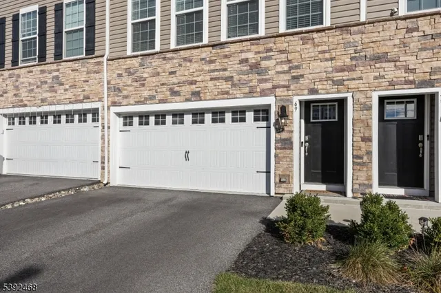 a view of a brick house with front door