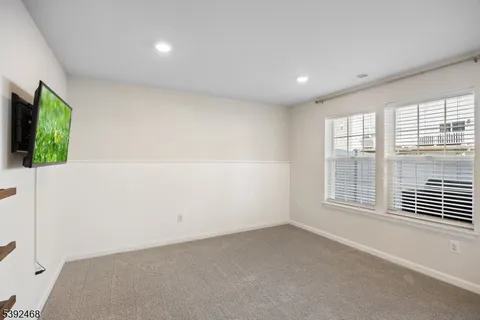 a view of a backyard with plants and a patio