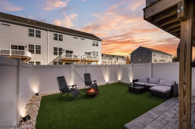 a view of kitchen with furniture and outdoor seating