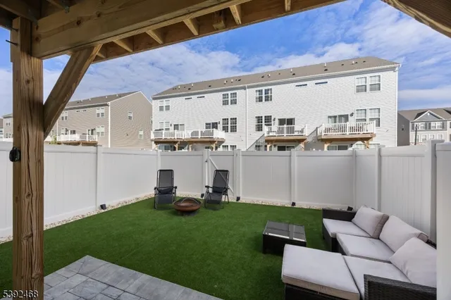 a view of house with backyard