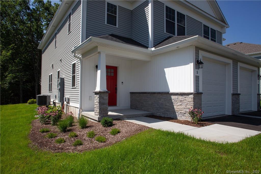 2 Murthas Way Granby, CT 06035 - Photo 2 of 28 a front view of a house with a yard