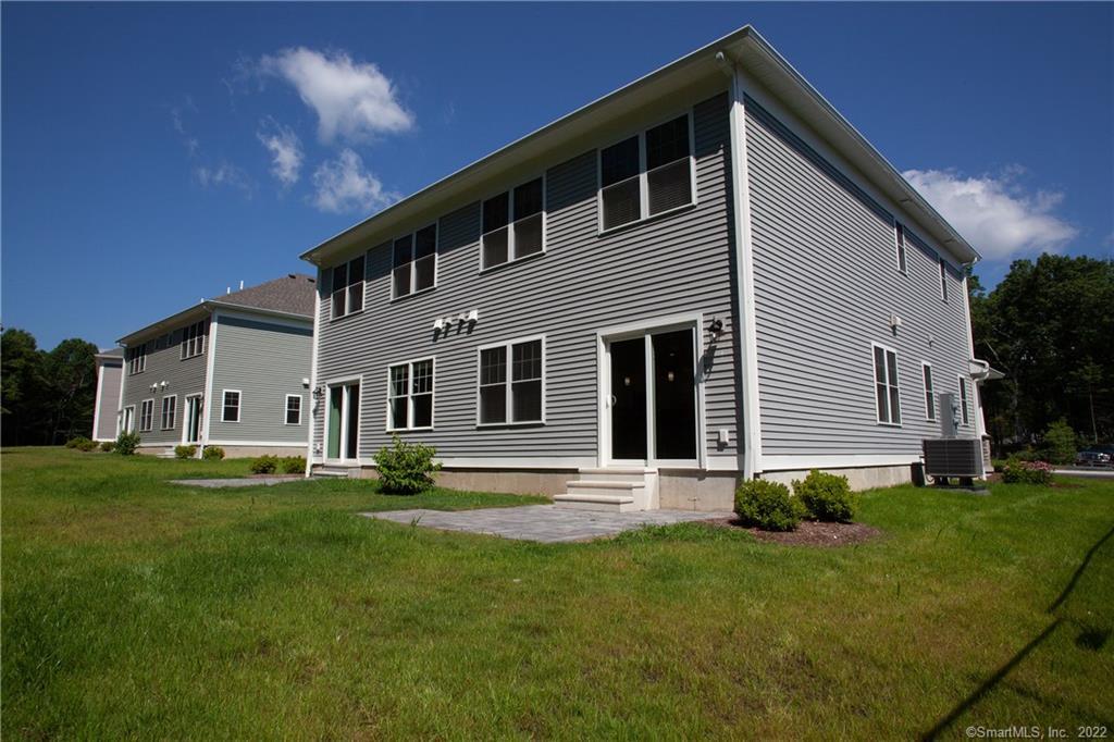 2 Murthas Way Granby, CT 06035 - Photo 25 of 28 a front view of a house with a garden