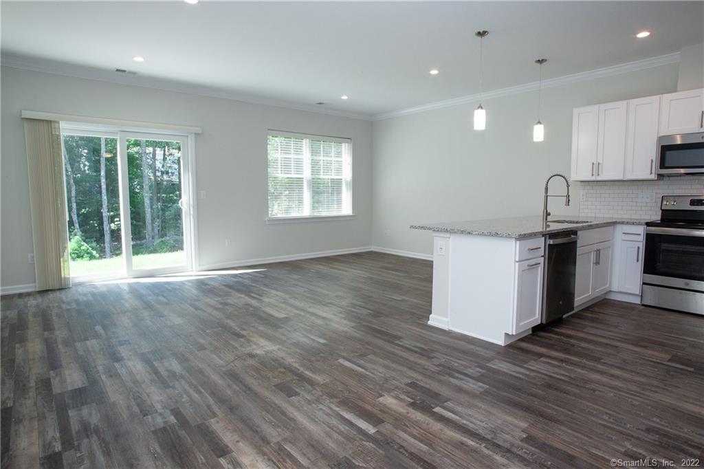 2 Murthas Way Granby, CT 06035 - Photo 4 of 28 a kitchen with stainless steel appliances granite countertop a stove a sink and a refrigerator