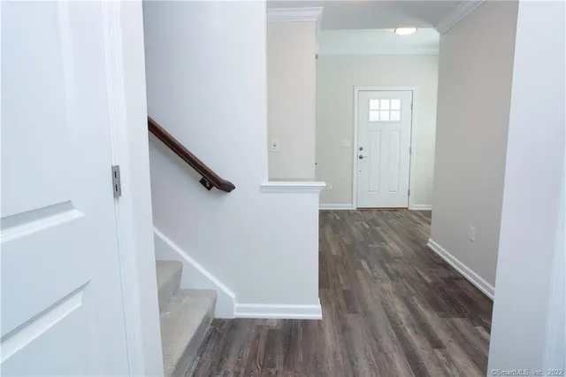a view of entryway with wooden floor