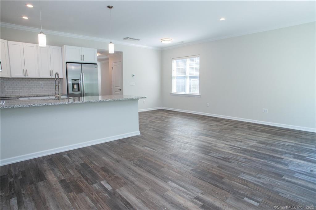 2 Murthas Way Granby, CT 06035 - Photo 10 of 28 an empty room with wooden floor and windows