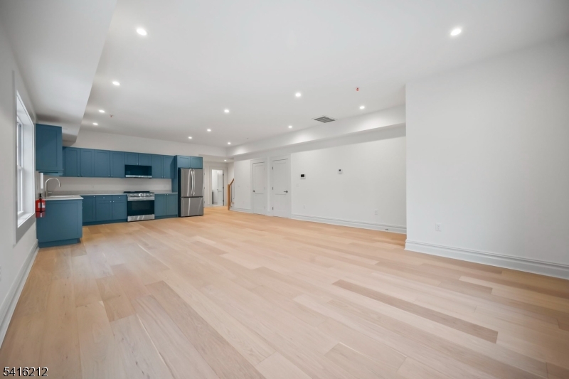 1209 Littleton Road, Unit E Morris Plains, NJ 07950 - Photo 12 of 27 a big room with closet and a flat screen tv