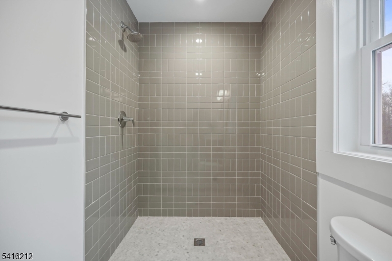 1209 Littleton Road, Unit E Morris Plains, NJ 07950 - Photo 17 of 27 a bathroom with a shower