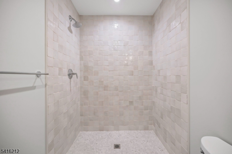 1209 Littleton Road, Unit E Morris Plains, NJ 07950 - Photo 19 of 27 a bathroom with a shower