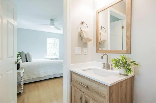 a bathroom with a sink and a mirror