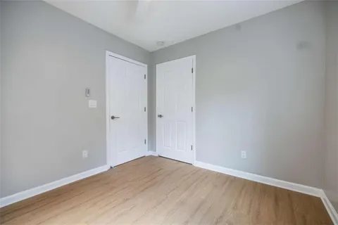 an empty room with wooden floor