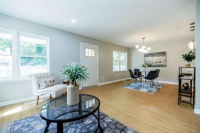 a view of a dining room with furniture and wooden floor
