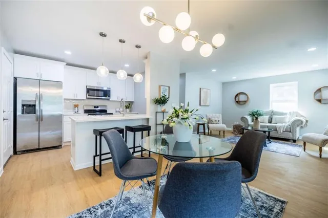 a view of kitchen with dining table and chairs