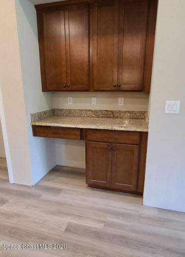 1179 Dania Circle Palm Bay, FL 32905 - Photo 6 of 11 a view of a kitchen with wooden floor