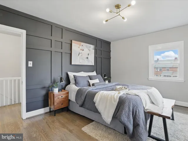 a view of a house with a yard and pathway