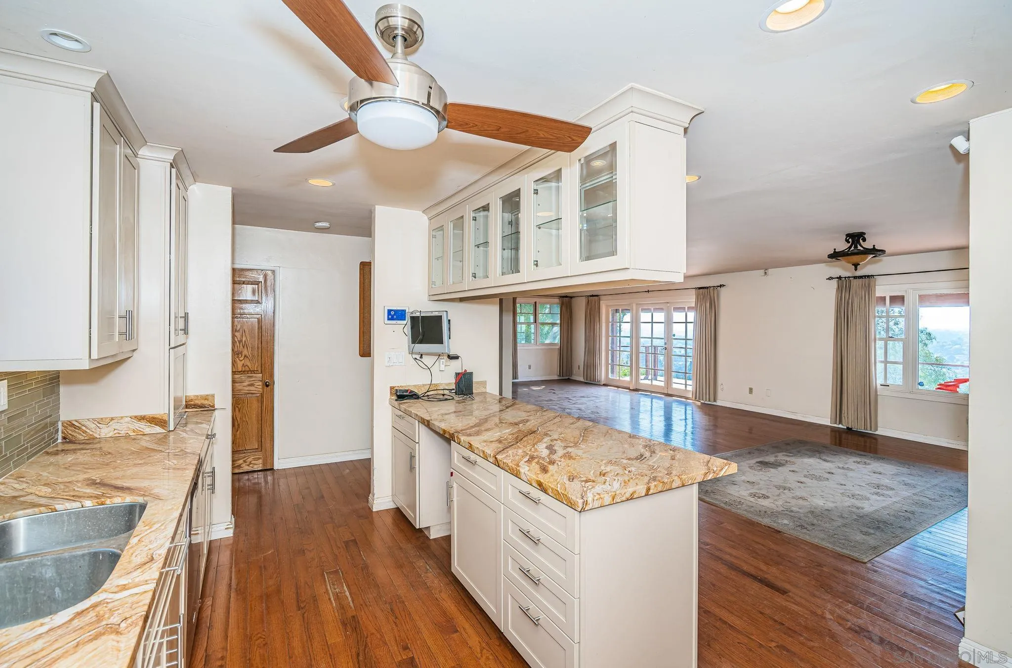 8046 Pasadena Avenue La Mesa, CA 91941 - Photo 13 of 32 a kitchen with a stove and a wooden floor