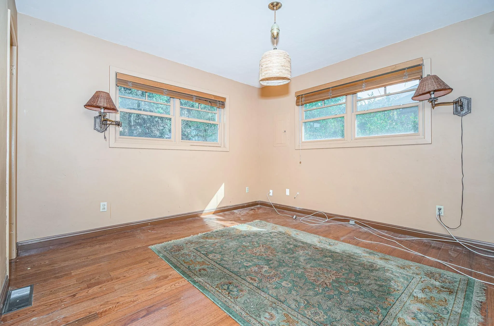8046 Pasadena Avenue La Mesa, CA 91941 - Photo 17 of 32 a view of an empty room with wooden floor and a window