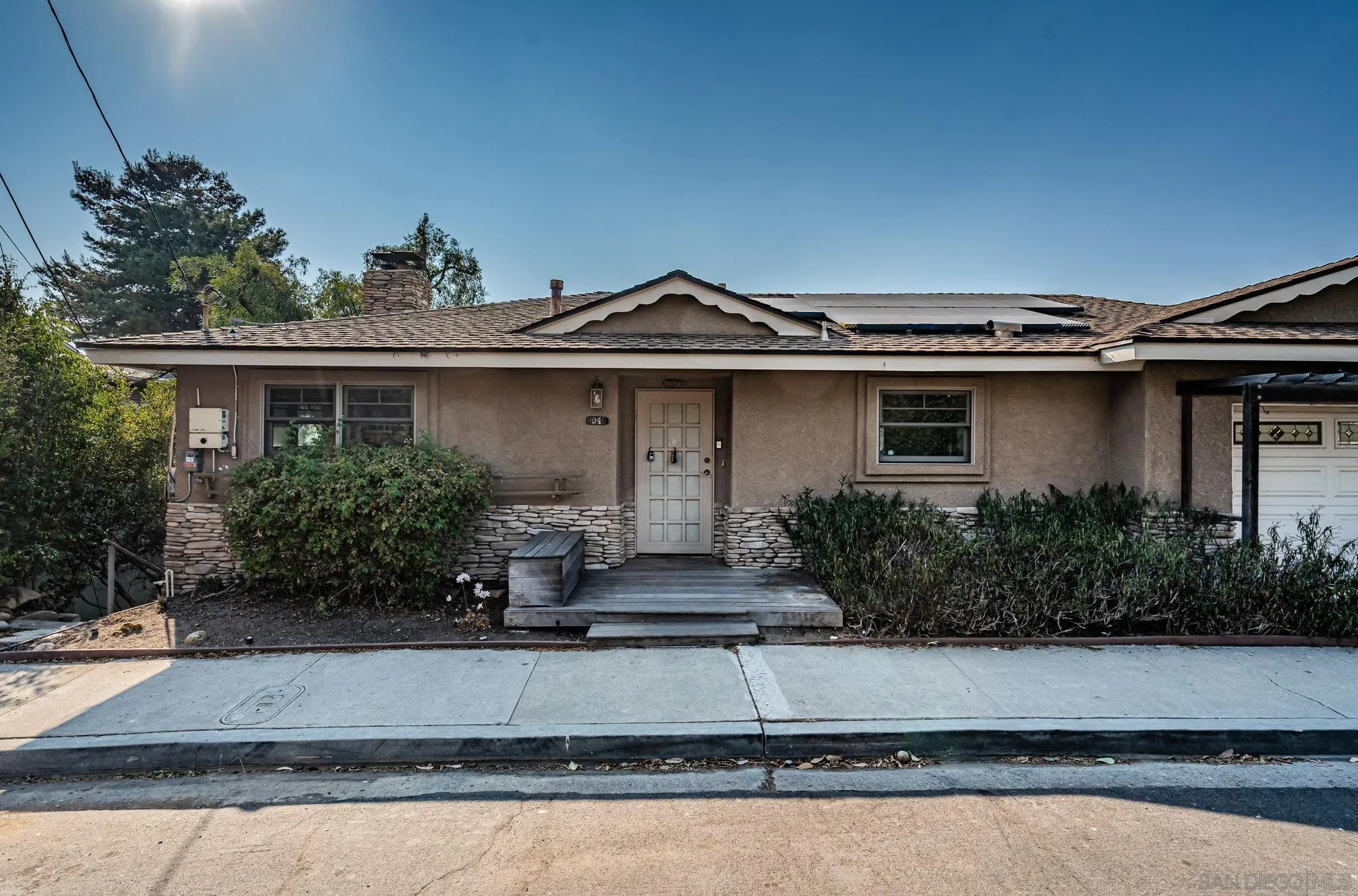 8046 Pasadena Avenue La Mesa, CA 91941 - Photo 3 of 32 a front view of a house with garden