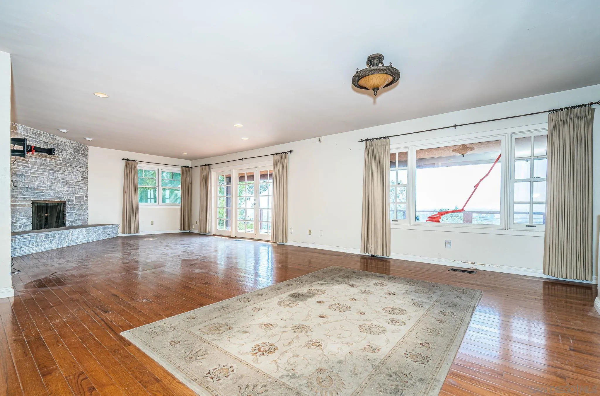 8046 Pasadena Avenue La Mesa, CA 91941 - Photo 4 of 32 wooden floor in an empty room with a window