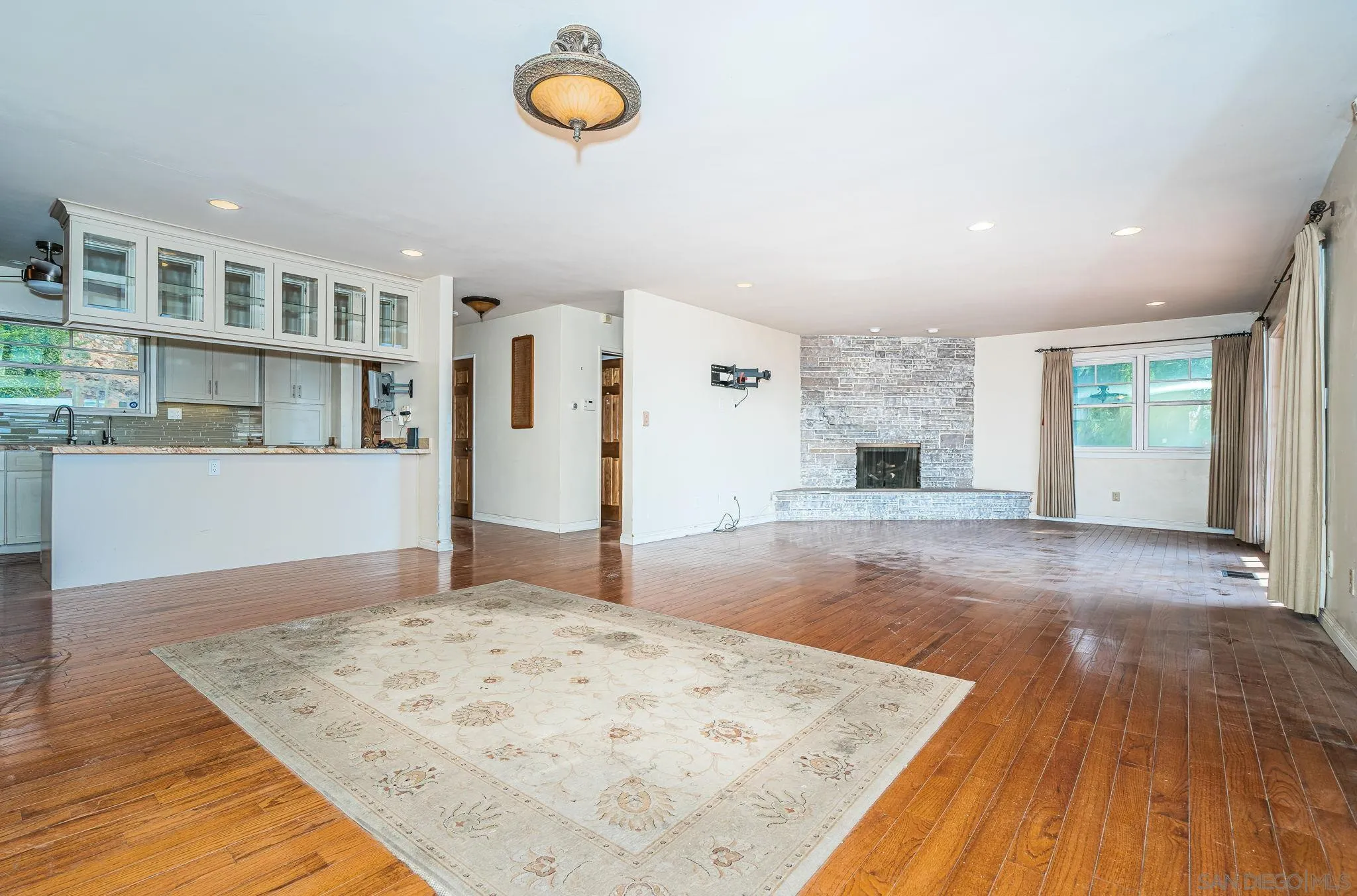 8046 Pasadena Avenue La Mesa, CA 91941 - Photo 5 of 32 a view of a kitchen with wooden floor and a sink