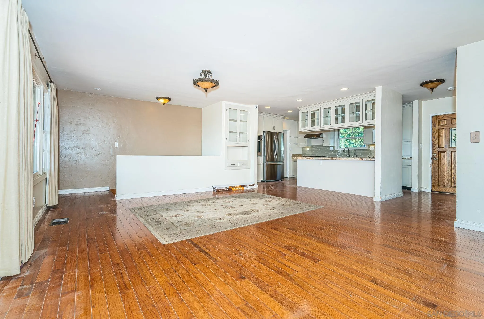 8046 Pasadena Avenue La Mesa, CA 91941 - Photo 7 of 32 a view of a kitchen cabinets and wooden floor