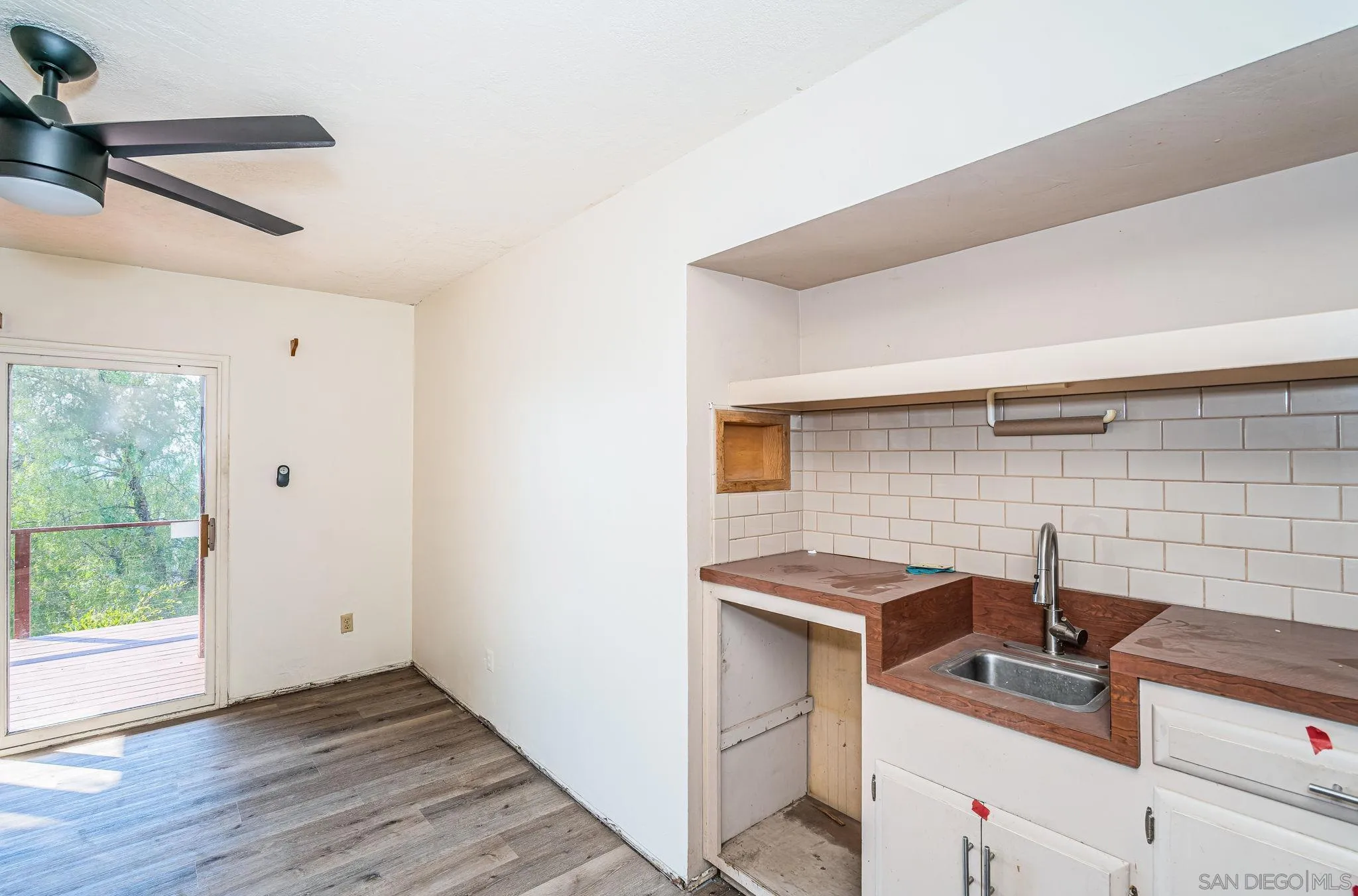 8046 Pasadena Avenue La Mesa, CA 91941 - Photo 9 of 32 a kitchen that has a sink and a stove